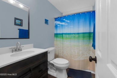 Charming waterview retreat! Welcome to 901 Caracara Drive a on Harbour Point Golf Club in North Carolina - for sale on GolfHomes.com, golf home, golf lot