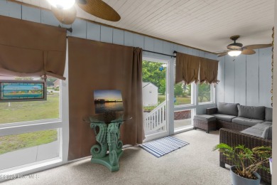 Charming waterview retreat! Welcome to 901 Caracara Drive a on Harbour Point Golf Club in North Carolina - for sale on GolfHomes.com, golf home, golf lot