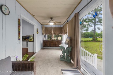 Charming waterview retreat! Welcome to 901 Caracara Drive a on Harbour Point Golf Club in North Carolina - for sale on GolfHomes.com, golf home, golf lot