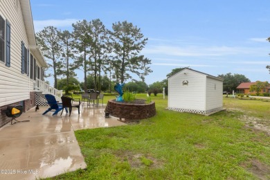 Charming waterview retreat! Welcome to 901 Caracara Drive a on Harbour Point Golf Club in North Carolina - for sale on GolfHomes.com, golf home, golf lot