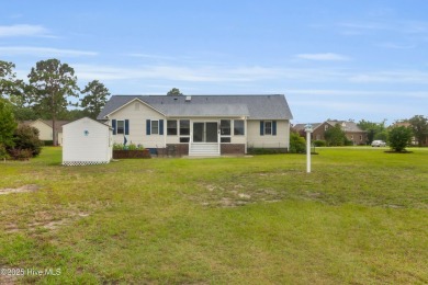 Charming waterview retreat! Welcome to 901 Caracara Drive a on Harbour Point Golf Club in North Carolina - for sale on GolfHomes.com, golf home, golf lot