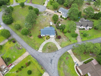 Charming waterview retreat! Welcome to 901 Caracara Drive a on Harbour Point Golf Club in North Carolina - for sale on GolfHomes.com, golf home, golf lot