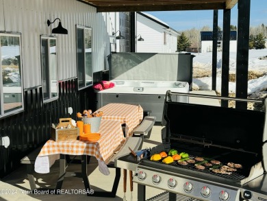 Discover the perfect blend of modern luxury and Wyoming's on Star Valley RV Golf Course in Wyoming - for sale on GolfHomes.com, golf home, golf lot