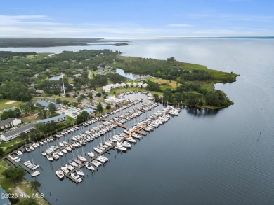 Charming waterview retreat! Welcome to 901 Caracara Drive a on Harbour Point Golf Club in North Carolina - for sale on GolfHomes.com, golf home, golf lot