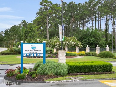 Charming waterview retreat! Welcome to 901 Caracara Drive a on Harbour Point Golf Club in North Carolina - for sale on GolfHomes.com, golf home, golf lot