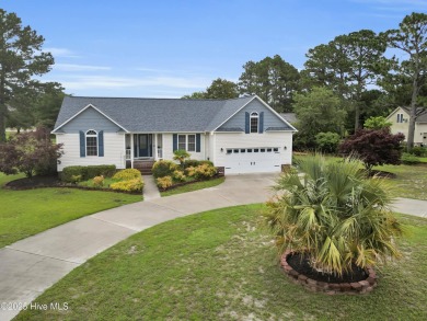 Charming waterview retreat! Welcome to 901 Caracara Drive a on Harbour Point Golf Club in North Carolina - for sale on GolfHomes.com, golf home, golf lot