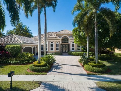 Discover this exquisite 4-bed 3.5-bath w/office & den pool home on Weston Hills Country Club in Florida - for sale on GolfHomes.com, golf home, golf lot