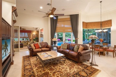 Discover this exquisite 4-bed 3.5-bath w/office & den pool home on Weston Hills Country Club in Florida - for sale on GolfHomes.com, golf home, golf lot