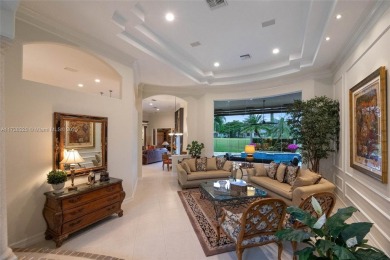 Discover this exquisite 4-bed 3.5-bath w/office & den pool home on Weston Hills Country Club in Florida - for sale on GolfHomes.com, golf home, golf lot