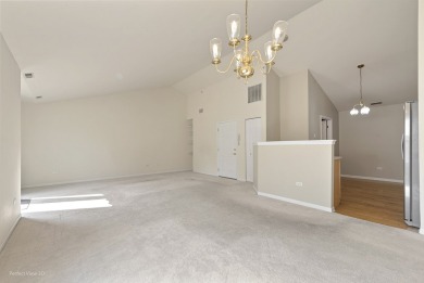This lovely second floor condo in a secure building features 2 on The Links at Carillon in Illinois - for sale on GolfHomes.com, golf home, golf lot