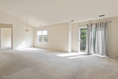 This lovely second floor condo in a secure building features 2 on The Links at Carillon in Illinois - for sale on GolfHomes.com, golf home, golf lot