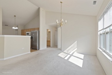This lovely second floor condo in a secure building features 2 on The Links at Carillon in Illinois - for sale on GolfHomes.com, golf home, golf lot