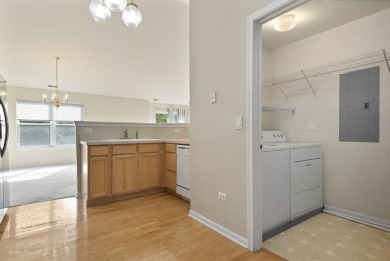 This lovely second floor condo in a secure building features 2 on The Links at Carillon in Illinois - for sale on GolfHomes.com, golf home, golf lot