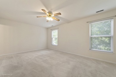 This lovely second floor condo in a secure building features 2 on The Links at Carillon in Illinois - for sale on GolfHomes.com, golf home, golf lot