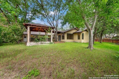 With lovely vistas of the Windcrest golf course, this spacious on Windcrest Golf Club in Texas - for sale on GolfHomes.com, golf home, golf lot