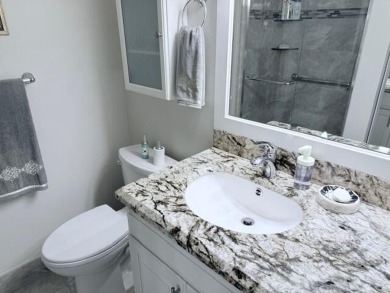 A most desirable waterfront location near pooles beautifully on Hillsboro Pines Golf in Florida - for sale on GolfHomes.com, golf home, golf lot