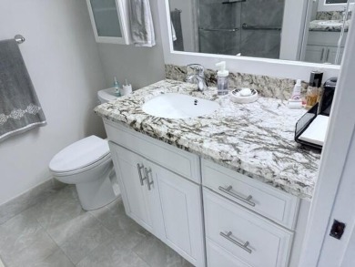 A most desirable waterfront location near pooles beautifully on Hillsboro Pines Golf in Florida - for sale on GolfHomes.com, golf home, golf lot
