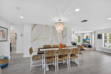 This stunning model home is tucked into the north end of the on Lake Worth Municipal Golf Course in Florida - for sale on GolfHomes.com, golf home, golf lot