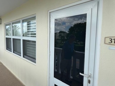 A most desirable waterfront location near pooles beautifully on Hillsboro Pines Golf in Florida - for sale on GolfHomes.com, golf home, golf lot