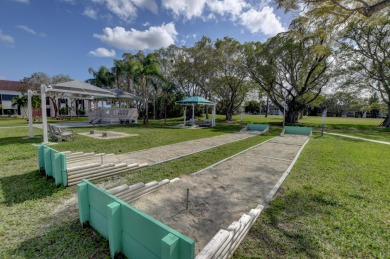 A most desirable waterfront location near pooles beautifully on Hillsboro Pines Golf in Florida - for sale on GolfHomes.com, golf home, golf lot