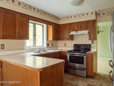 This beautifully maintained 4-bedroom, 2.5-bath single-family on Wolferts Roost Country Club in New York - for sale on GolfHomes.com, golf home, golf lot