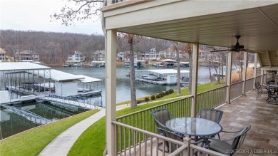 Discover the ultimate lakefront lifestyle in this stunning home on The Club At Porto Cima in Missouri - for sale on GolfHomes.com, golf home, golf lot