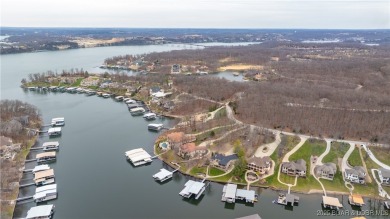 Discover the ultimate lakefront lifestyle in this stunning home on The Club At Porto Cima in Missouri - for sale on GolfHomes.com, golf home, golf lot