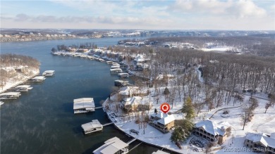 Discover the ultimate lakefront lifestyle in this stunning home on The Club At Porto Cima in Missouri - for sale on GolfHomes.com, golf home, golf lot