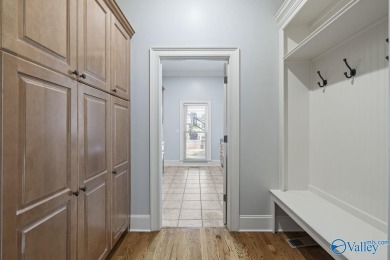 Exceptional luxury living in this stunning 5-bedroom, 7-bath on Hampton Cove Golf Course in Alabama - for sale on GolfHomes.com, golf home, golf lot