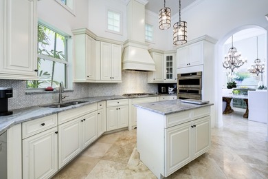 Live luxuriously on the 16th green of the Arnold Palmer on Frenchmans Reserve in Florida - for sale on GolfHomes.com, golf home, golf lot