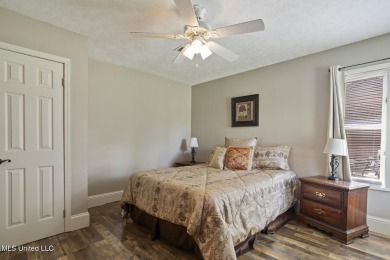 This mid-century modern home has been tastefully updated while on Colonial Country Club Deerfield in Mississippi - for sale on GolfHomes.com, golf home, golf lot