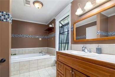 Love a golf-course backdrop? This 4BR/3BA Timber Trails home on The Golf Club At Timber Trails in Louisiana - for sale on GolfHomes.com, golf home, golf lot