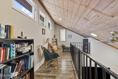This mid-century modern home has been tastefully updated while on Colonial Country Club Deerfield in Mississippi - for sale on GolfHomes.com, golf home, golf lot