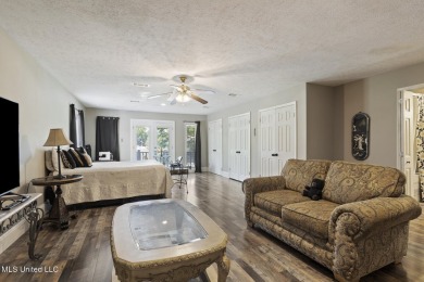This mid-century modern home has been tastefully updated while on Colonial Country Club Deerfield in Mississippi - for sale on GolfHomes.com, golf home, golf lot