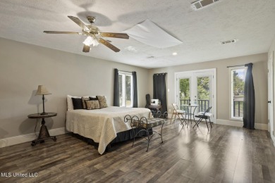 This mid-century modern home has been tastefully updated while on Colonial Country Club Deerfield in Mississippi - for sale on GolfHomes.com, golf home, golf lot