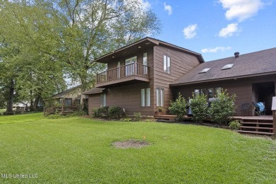 This mid-century modern home has been tastefully updated while on Colonial Country Club Deerfield in Mississippi - for sale on GolfHomes.com, golf home, golf lot
