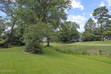 This mid-century modern home has been tastefully updated while on Colonial Country Club Deerfield in Mississippi - for sale on GolfHomes.com, golf home, golf lot