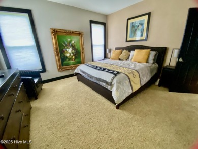 STUNNING HOME WITH WATER & GOLF COURSE VIEWS-YOUR EVERYDAY on Sandpiper Bay Golf and Country Club in North Carolina - for sale on GolfHomes.com, golf home, golf lot