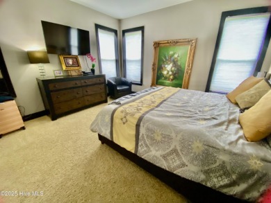 STUNNING HOME WITH WATER & GOLF COURSE VIEWS-YOUR EVERYDAY on Sandpiper Bay Golf and Country Club in North Carolina - for sale on GolfHomes.com, golf home, golf lot
