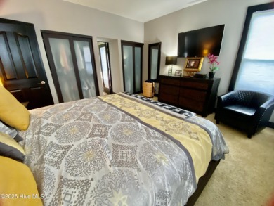 STUNNING HOME WITH WATER & GOLF COURSE VIEWS-YOUR EVERYDAY on Sandpiper Bay Golf and Country Club in North Carolina - for sale on GolfHomes.com, golf home, golf lot