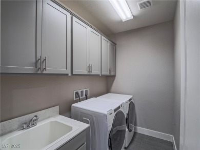 Distinguished 3-story brownstone-style townhome on a premium on Reflection Bay Golf Club in Nevada - for sale on GolfHomes.com, golf home, golf lot