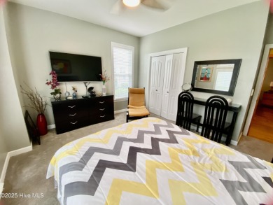STUNNING HOME WITH WATER & GOLF COURSE VIEWS-YOUR EVERYDAY on Sandpiper Bay Golf and Country Club in North Carolina - for sale on GolfHomes.com, golf home, golf lot