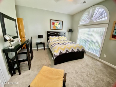 STUNNING HOME WITH WATER & GOLF COURSE VIEWS-YOUR EVERYDAY on Sandpiper Bay Golf and Country Club in North Carolina - for sale on GolfHomes.com, golf home, golf lot
