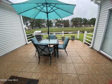 STUNNING HOME WITH WATER & GOLF COURSE VIEWS-YOUR EVERYDAY on Sandpiper Bay Golf and Country Club in North Carolina - for sale on GolfHomes.com, golf home, golf lot