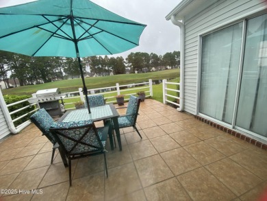 STUNNING HOME WITH WATER & GOLF COURSE VIEWS-YOUR EVERYDAY on Sandpiper Bay Golf and Country Club in North Carolina - for sale on GolfHomes.com, golf home, golf lot