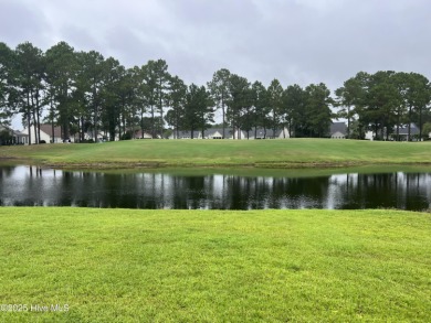 STUNNING HOME WITH WATER & GOLF COURSE VIEWS-YOUR EVERYDAY on Sandpiper Bay Golf and Country Club in North Carolina - for sale on GolfHomes.com, golf home, golf lot
