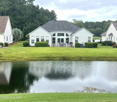 STUNNING HOME WITH WATER & GOLF COURSE VIEWS-YOUR EVERYDAY on Sandpiper Bay Golf and Country Club in North Carolina - for sale on GolfHomes.com, golf home, golf lot
