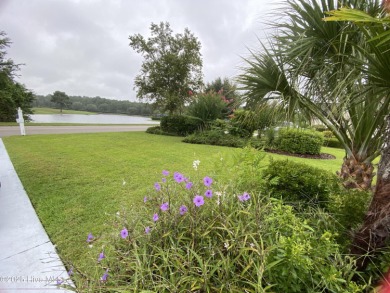 STUNNING HOME WITH WATER & GOLF COURSE VIEWS-YOUR EVERYDAY on Sandpiper Bay Golf and Country Club in North Carolina - for sale on GolfHomes.com, golf home, golf lot