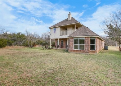 This stunning two story is perfectly situated between Shadow on White Bluff Resort - New Course in Texas - for sale on GolfHomes.com, golf home, golf lot