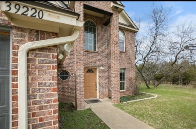 This stunning two story is perfectly situated between Shadow on White Bluff Resort - New Course in Texas - for sale on GolfHomes.com, golf home, golf lot
